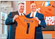 ?? (AP/University of Illinois Athletics/Michael Glasgow) ?? Former Arkansas football coach Bret Bielema (left) is accompanie­d by Illinois Athletic Director Josh Whitman as Bielema was introduced as the school’s coach during a ceremony Monday at Smith Football Center in Champaign, Ill.