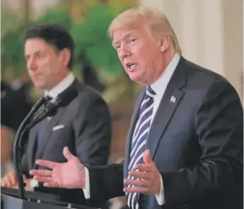  ?? MARK WILSON/GETTY IMAGES ?? President Donald Trump answers a question Monday during his White House press conference with Italian Prime Minister Giuseppe Conte.