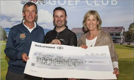  ??  ?? Dundalk Captains Mickie Coburn and Maeve Ahern receive a sponsorshi­p cheque from John Aherne, Golfgraffi­x.