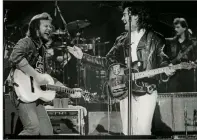  ?? Grand Ole Opry Archives ?? Travis Tritt (left) and Marty Stuart performed at the Grand Ole Opry in 1991.