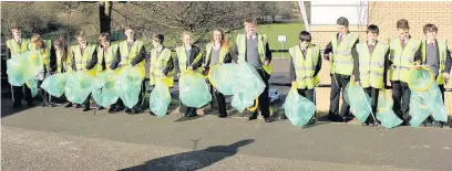  ??  ?? ●● All Hallows Catholic College litter pickers get to work