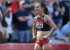  ?? ASHLEY LANDIS — THE ASSOCIATED PRESS ?? Jenny Simpson smiles despite a 10th-place finish in the finals of the women’s 1,500-meter run Monday at the U.S. Olympic Track and Field Trials in Eugene, Ore.