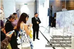  ??  ?? YAZEED memberi penerangan kepada wakil media mengenai butik terbaru di Pavilion.