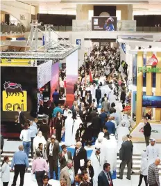  ?? Abdul Rahman/Gulf News ?? Delegates tour the various pavilions after the opening ■ of Adipec 2018 in Abu Dhabi yesterday.