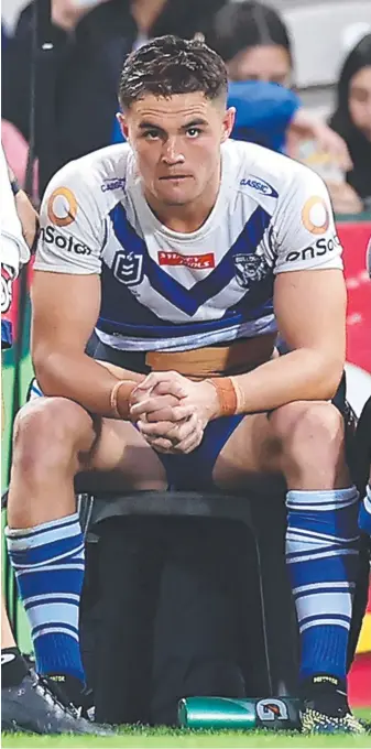  ??  ?? Bulldogs halfback Kyle Flanagan after being hooked midgame by coach Trent Barrett during the defeat to the Dragons. Picture: Getty Images