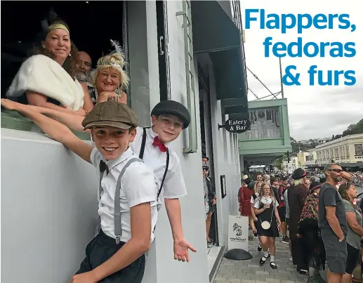  ?? MARTY SHARPE/STUFF ?? Karen Snee, left, and Jenny Mark enjoy great views of the Soap Box Derby, as Jack Sorenson, left, and Fynn Taylor look on at Napier’s Art Deco Festival.