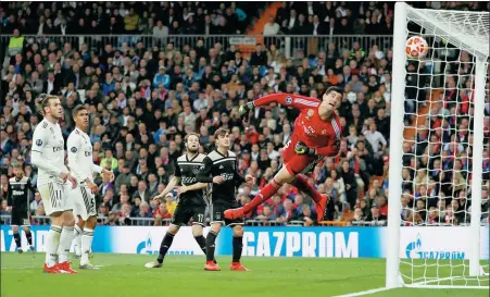  ?? SUSANA VERA / REUTERS ?? A freekick from Lasse Schone (not pictured) flies past the despairing dive of Real Madrid goalkeeper Thibaut Courtois during Ajax’s shock 4-1 Champions League last-16, second-leg victory at Santiago Bernabeu Stadium in Madrid. Real lost 5-3 on aggregate.