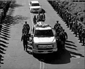  ?? JOHN LOCHER/AP ?? An honor guard escorts the body of Las Vegas Officer Charleston Hartfield, 34, to his hometown of Henderson.