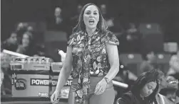  ?? JULIO CORTEZ/AP ?? Arizona head coach Adia Barnes talks to her team against Maryland during the first half on Sunday.