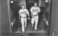  ?? RON CHENOY, USA TODAY SPORTS ?? Dodgers middle infielders Chase Utley, left, and Corey Seager have had plenty to smile about this season.