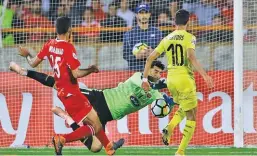  ??  ?? MOHAMMAD Karam-ali/90tv.ir Persepolis keeper Alireza Beiranvand (C) makes a heroic save to deny Al Sadd’s Hassan al-haydos (R) during a 1-1 draw at the 2018 AFC Champions League semifinals at the Azadi Stadium in Tehran, Iran, on October 23, 2018.