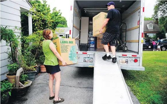  ?? CHRIS DUNN/THE ASSOCIATED PRESS ?? Moving to a new place can take a toll emotionall­y and financiall­y. Preparing a budget and doing at least some of the work yourself can help.