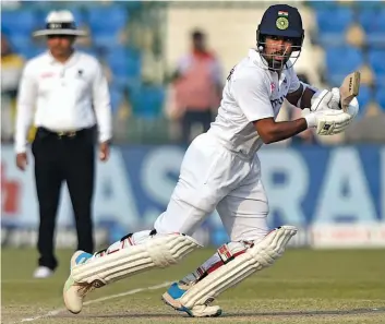  ?? — PTI ?? India’s Wriddhiman Saha plays a shot on the fourth day of the first Test against New Zealand at Green Park Stadium in Kanpur on Sunday.