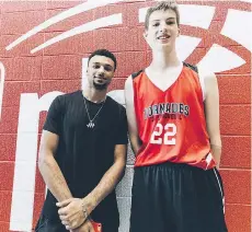  ?? THE CANADIAN PRESS/NBA ?? Canadian NBA star Jamal Murray looks like a kid next to Olivier Rioux, 12, who is six foot 10.