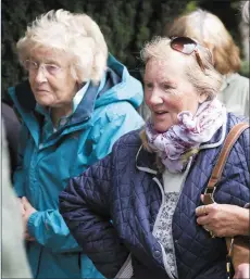  ??  ?? Dorothy Talbot-Martin and Mary Breen listen intently during the tour of Delgany graveyard.