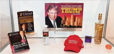  ??  ?? Trump games, books, water, alcohol, and other items on display as part of the exhibition ‘celebratin­g’ commercial failures at the Museum of Failure. — Photos: AFP