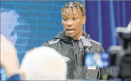  ?? Heidi Fang Las Vegas Review-journal @Heidifang ?? Former Alabama wideout Henry Ruggs speaks at the NFL scouting combine in Indianapol­is on Feb. 25. The Raiders drafted Ruggs with the 12th overall pick.