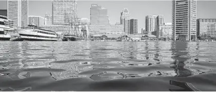  ?? JERRY JACKSON/BALTIMORE SUN ?? A renewed effort to clean Baltimore’s Inner Harbor is aiming to make it swimmable by 2030.