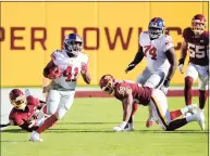  ?? Patrick McDermott / Getty Images ?? The Giants’ Alfred Morris runs with the ball against Washington on Nov. 8. The veteran running back had 67 yards in the game.