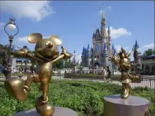  ?? John Raoux/Associated Press ?? Allies of Florida Gov. Ron DeSantis and Disney reached a settlement agreement Wednesday in a lawsuit over who controls Walt Disney World’s governing district.
