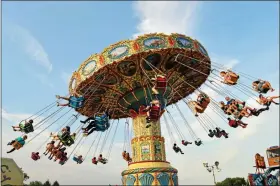  ?? SUBMITTED PHOTO ?? People whirl around on the swing ride at the Strawberry Festival.