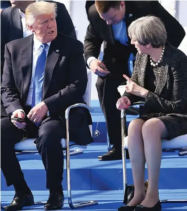  ??  ?? Confronted: Donald Trump and Theresa May at a Nato summit in Brussels yesterday