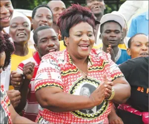  ??  ?? Newly-elected Bikita West National Assembly member Cde Beauty Chabaya is joined by ZANU-PF supporters in song during victory celebratio­ns yesterday. (Picture by John Manzongo)