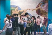  ?? PHOTOS BY JIANG DONG / CHINA DAILY ?? Visitors at the ongoing exhibition that showcases copies of Michelange­lo’s most celebrated works and his architectu­ral designs at the Bird’s Nest Culture Center in Beijing.