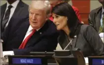  ?? SETH WENIG, THE ASSOCIATED PRESS ?? President Donald Trump speaks with U.S. Ambassador to the United Nations Nikki Haley at UN headquarte­rs on Monday.