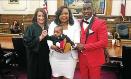  ?? CARL HESSLER JR. - DIGITAL FIRST MEDIA ?? Aaron Eugene and Lauren Simmons of Schwenksvi­lle exchanged vows during a special Valentine’s Day event at the Montgomery County Courthouse Tuesday, Feb. 14, 2017. “Valentine’s Day is filled with love and joy, a day to cherish the love,” Eugene said...