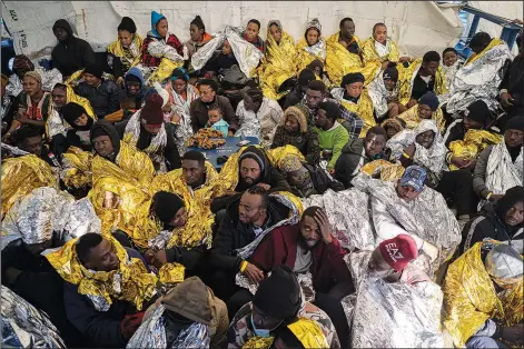  ?? ?? Migrants and refugees from Africa are assisted Jan. 28 at the rescue ship of the Spanish NGO Aita Mary after being rescued in the Mediterran­ean Sea, about 103 miles from the Libyan coast. Stories circulatin­g online incorrectl­y claim the U.N. is warning of a massive refugee movement from Africa with 500 million on their way to Europe. (File Photo/AP/Pau de la Calle)