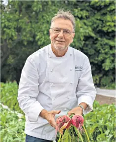  ?? ?? Raymond Blanc at work in the kitchen gardens, where he grows much of his produce