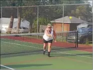 ??  ?? An experience­d pickleball player shows off her skills.