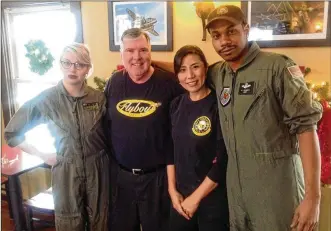  ?? AMELIA ROBINSON/STAFF ?? Flyboys Deli owner Steve Crandall and Eunice Kim (middle) with staff members Sephrah Walsworth and Ernest Conner. Walsworth and Conner often wear Crandall’s old Air Force flight suits.