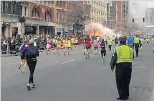  ??  ?? One of the bombs explodes near the fi nish line of the 2013 Boston Marathon