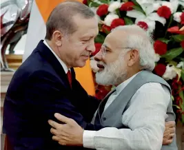  ?? — PTI ?? Prime Minister Narendra Modi embraces Turkish President Recep Tayyip Erdogan after delivering their joint press statement in New Delhi on Monday.