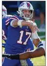  ?? (AP/John Munson) ?? Buffalo quarterbac­k Josh Allen was 31 of 38 and equaled his career best with 415 yards passing to l ead the AFC East-leading Bills to a 44-34 victory over the Seattle Seahawks on Sunday in Orchard Park, N.Y. Buffalo is 7-2 through nine games for the first time since 1993.