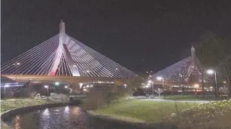  ?? PHOTO COURTESY OF LYNNETTE ALAMEDDINE ?? IN MEMORIAM: The Massachuse­tts Department of Transporta­tion lighted up the Zakim Bridge on April 16, to commemorat­e the 10th anniversar­y of the Virginia Tech massacre, when a lone gunman killed 32 people and wounded 17 more.