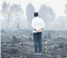  ?? Photo / AP ?? Indonesian President Joko Widodo inspects the damage by a fire in Pelalawan in Indonesia’s Riau province.