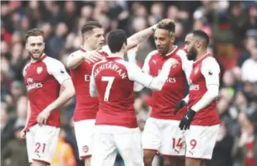  ??  ?? Arsene Wenger impressed as Aubayemang hands hat-trick penalty to Lacazette