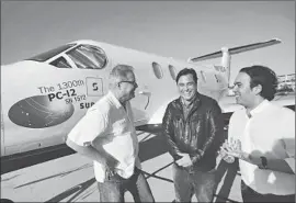  ?? Genaro Molina
Los Angeles Times ?? JEFF POTTER , Surf Air’s CEO, left, investor William Woodward and executive chairman Sudhin Shahani enjoy a light moment at Hawthorne Municipal Airport.