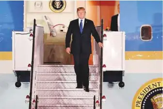  ?? AP ?? Trump disembarks at Paya Lebar Air Base in Singapore yesterday. Asked by a reporter how he felt about the summit with Kim Jong-un, the US President said: ‘Very good’.