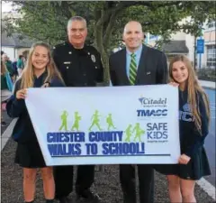  ?? SUBMITTED PHOTO ?? Chester County District Attorney Tom Hogan and Malvern Chief of Police Louis Marcelli with two students from St. Patrick School in Malvern.