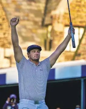  ?? CHARLES KRUPA AP ?? Bryson Dechambeau raises his arms after sinking a putt for par on the 18th hole to win the U.S. Open. He was the only player to finish the tournament under par at 6 under.