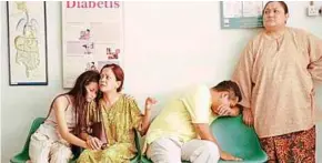  ??  ?? a scene from yasmin ahmad’s Gubra where Orked and family gather at the hospital after her father is admitted.