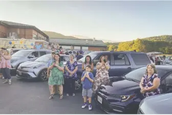  ?? BY LUKE CHRISTOPHE­R FOR FOOTHILLS FORUM ?? Families watch last weekend’s graduation, where Schools Superinten­dent Dr. Shannon Grimsley, below, said the Class of 2020 “literally set their clocks back from standard time this year to the Twilight Zone.”