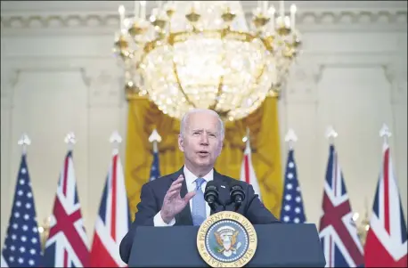  ?? ANDREW HARNIK — THE ASSOCIATED PRESS ?? President Joe Biden, joined virtually by Australian Prime Minister Scott Morrison and British Prime Minister Boris Johnson, speaks about a national security initiative from the East Room of the White House in Washington, Sept. 15.