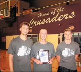  ?? PHOTO PROVIDED. ?? The first place team from last year’s Catholic Central High School Box-Out Bullying basketball tournament fundraiser pose for a photo.