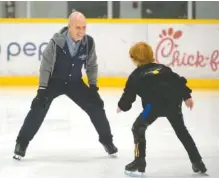  ?? PHOTO BY SHELLEY MAYS/THE TENNESSEAN ?? Scott Hamilton and his son Maxx skate at Ford Ice Center in Nashville in October 2016. Hamilton wants to make Nashville the epicenter for figure skating in the United States.