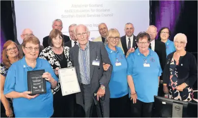  ??  ?? Thrilled Volunteers collected the award at the ceremony